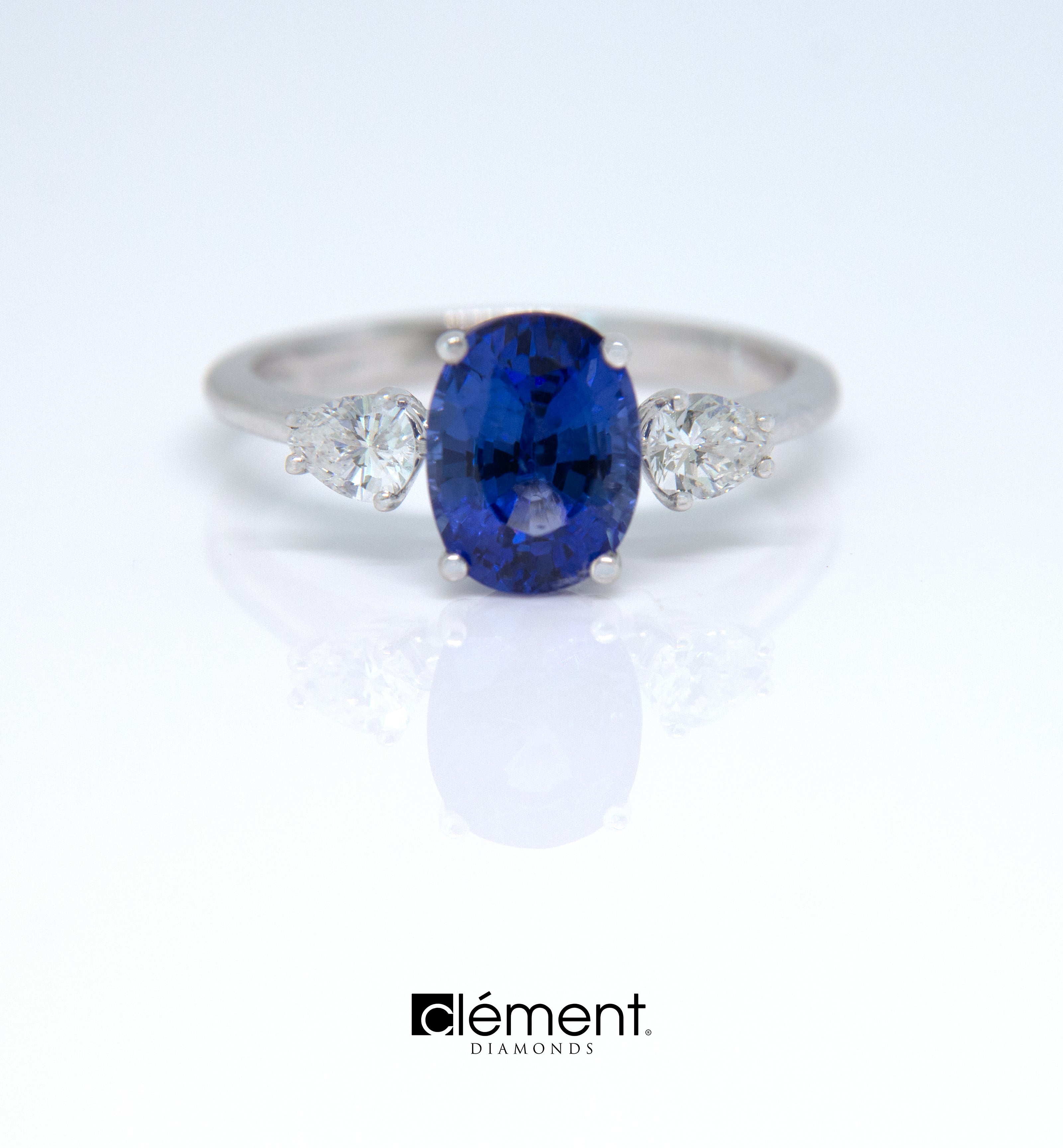 18ct White Gold Blue Sapphire Ring With Side Pear Shape Diamonds